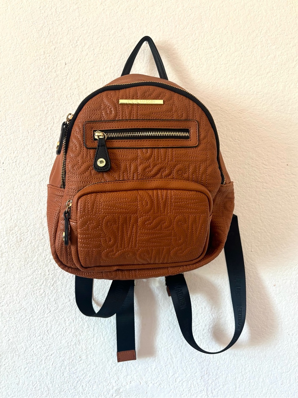 Steve Madden Textured Mini Backpack in Cognac Brown with Black Trim